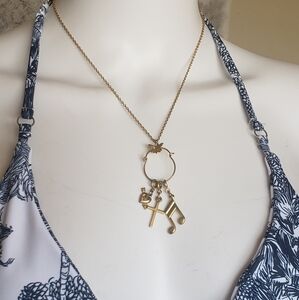 Antique Gold Charm Necklace with Heart, Cross, and Music Note.